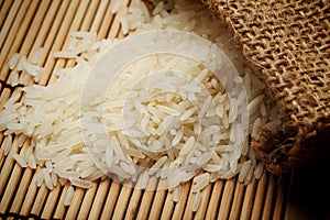 White uncooked rice in small sack