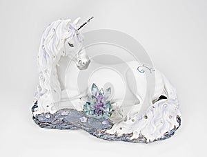 White unicorn sculpture, enchanting magical figurine, dreamer