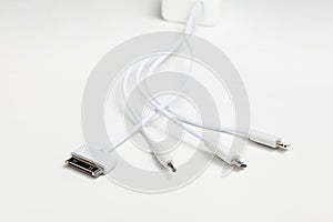 White universal charging cable, adapter with micro USB, usb connectors for different models of phones and devices
