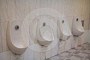 White urinal men men`s public toilet