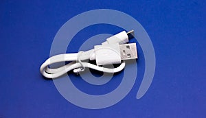 A white USB cable against
