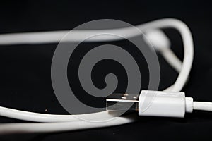 A white usb cable with a black background