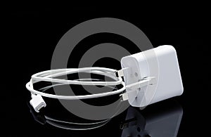 White USB cable for smartphone and its reflection