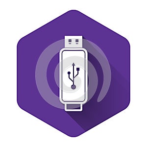 White USB flash drive icon isolated with long shadow. Purple hexagon button