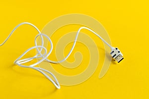 USB Micro cable isolated on yellow background