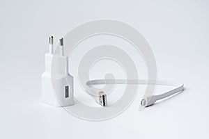 White USB power adapter and cable for divice isolated on a white background