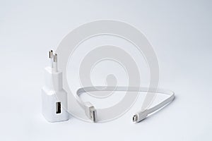 White USB power adapter and cable for divice isolated on a white background