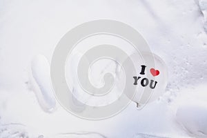 White Valentines Day balloon with the text I love you in fresh white snow background, Copy space, Love,winter,Valentine
