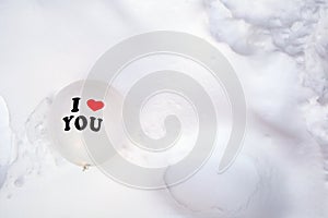 White Valentines Day balloon with the text I love you in fresh white snow background, Copy space, Love,winter,Valentine