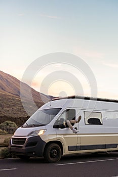 White Van Parked Amidst Scenic Mountains at sunrise