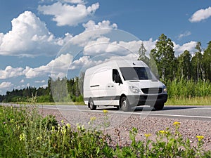 White van on summer rural highway