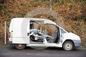 White van vandalised and abandoned in rural countryside
