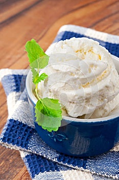 White vanilla ice-cream with green mint leaf