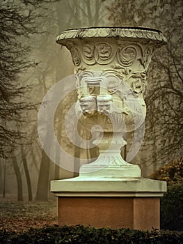 White vase sculpture in the fog in the fall. Gomel, Belarus