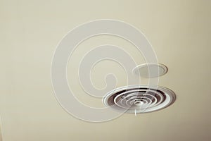White vent hole in the ceiling