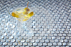 White vermouth cocktail on modern stainless steel