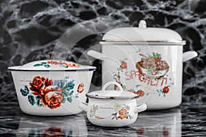 White Vintage Enamel Saucepans with Various Designs