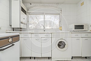 White vintage kitchen with window with views, white appliances