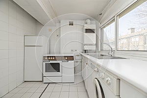 White vintage kitchen with window with views, white appliances