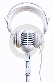 White vintage microphone and headphones