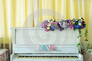 White vintage pianino with Love latters