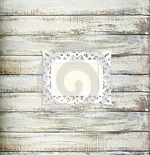 White Vintage picture frame on old wood background