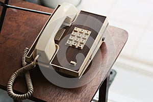 white vintage telephone in hotel lobby