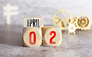 White vintage wood block calendar present date 02 and month April