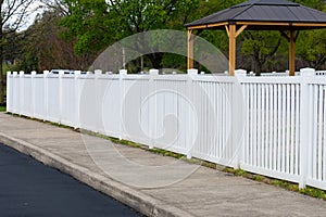 White vinyl fence fencing of private property