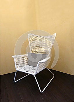 White vinyl stool chair on floor background