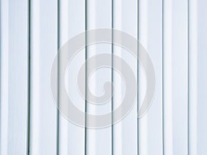 White vinyl wood siding panel background with imitation wood texture