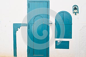 White wall and blue door and window - Asilah, Morocco.