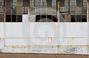 White wall with broken windows