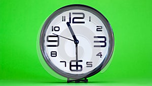 White wall clock green background