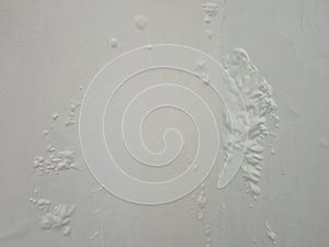 White wall surface with cracked paint and bubbles texture