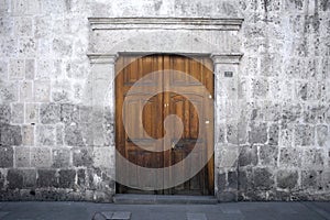 White walls and doors of the old streets of the city of Arequipa in Peru.