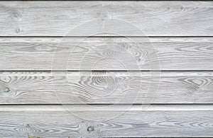 White wash painted texture wooden background of shelves planks with growth rings and wood grain vains