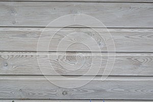 White wash painted texture wooden background of shelves planks with growth rings and wood grain vains