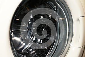White washing machine door in laundry