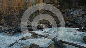 White Water Cascading Shallow Stream Flowing Between Grey Rocks In Siberian Mountain Highland