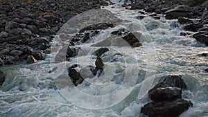 White Water Cascading Shallow Stream Flowing Between Grey Rocks In Siberian Mountain Highland