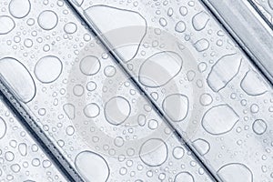 white water drops isolated on steel plate background