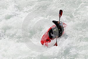 White water kayaking on the rapids of river