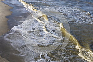 The white water ocean waves at the Atlantic Ocean at Kure Beach North Carolina