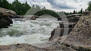 White water rushing at Pabineau Falls, New Brunswick, Canada