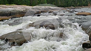 White water rushing at Pabineau Falls, New Brunswick, Canada