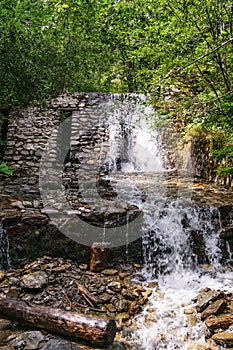 White waterfall and rockery stone masonry wall
