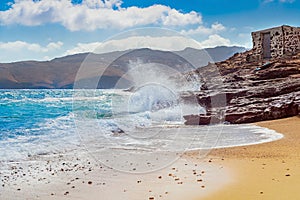 White waves of the azure sea of the Greek island of Mykonos.