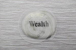 White wealth mood stone on gray background