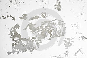 The White weathered wall with flaking paint background